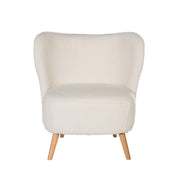 Sillón tapizado en color blanco con patas de madera.
