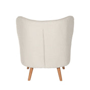 Sillón tapizado en color blanco con patas de madera.
