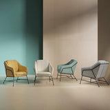 Odense armchair with metal legs and back.